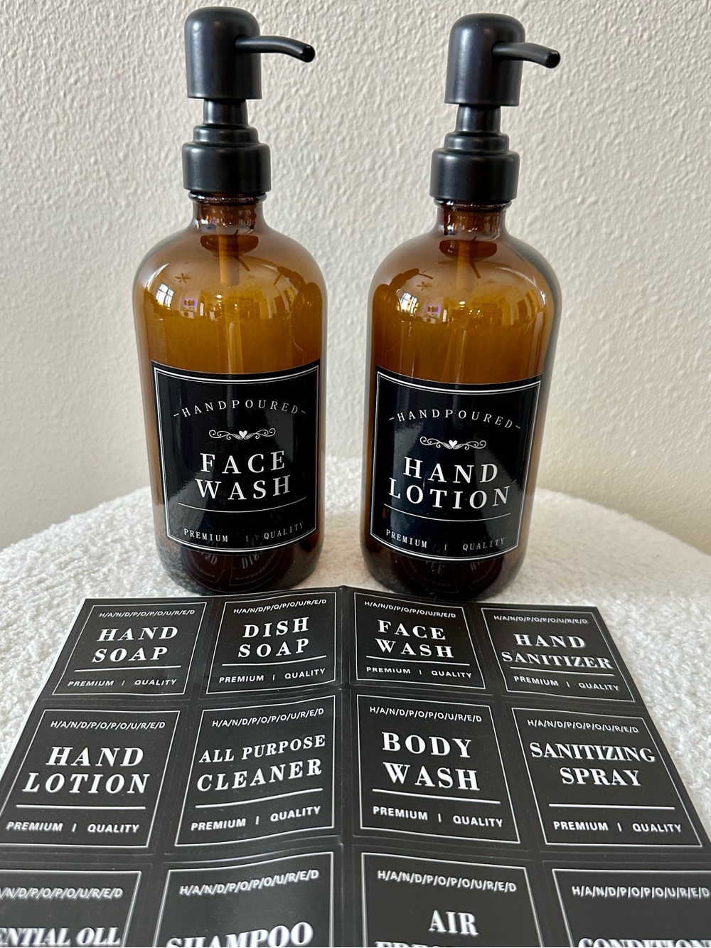 Set of 2 - Amber glass dispenser bottles with labels